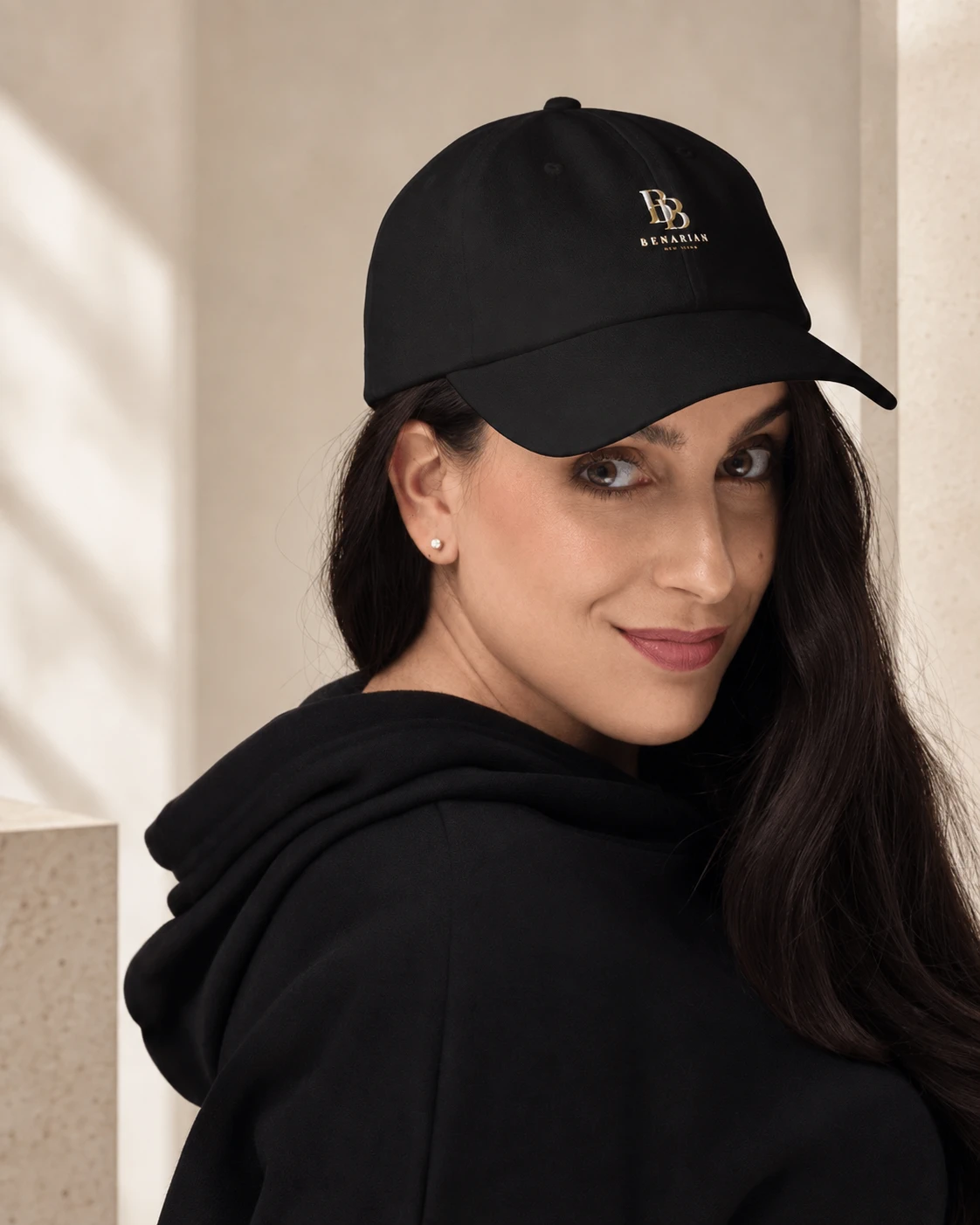 Model in black wearing BENARIAN Signature Cap